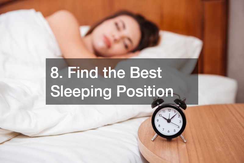 an alarm clock and a woman sleeping